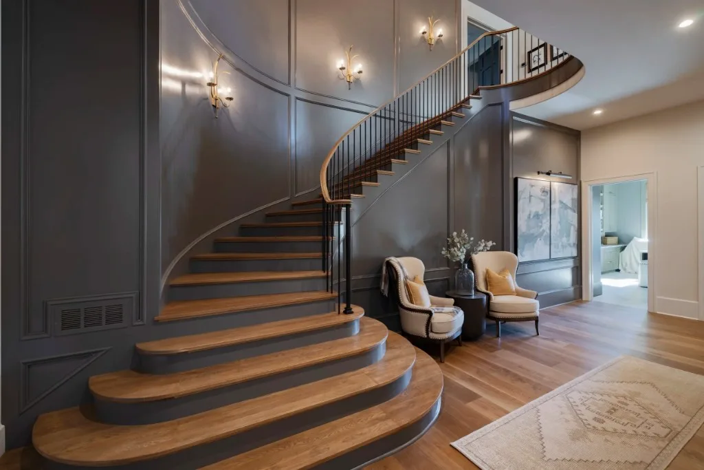Berkeley Lake — curved staircase with charcoal paneling