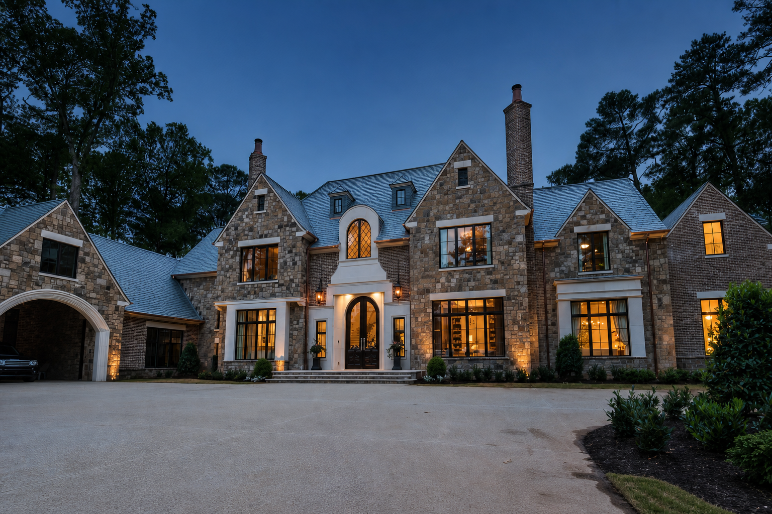 A high-end residence at dusk designed by Logan Design Group