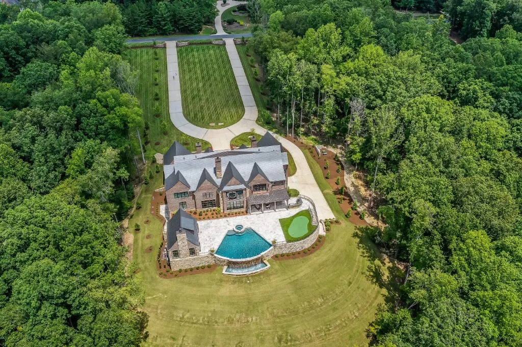 Mtn Lake — aerial view of roofline, pool, and forest