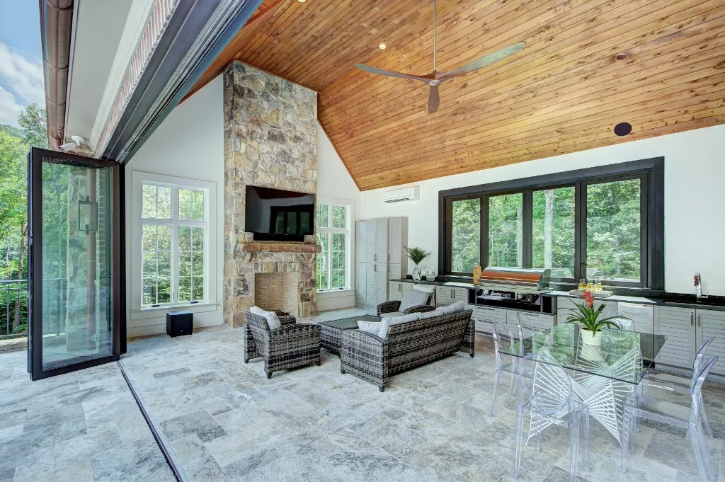 Mtn Lake — covered patio with stone fireplace and outdoor kitchen