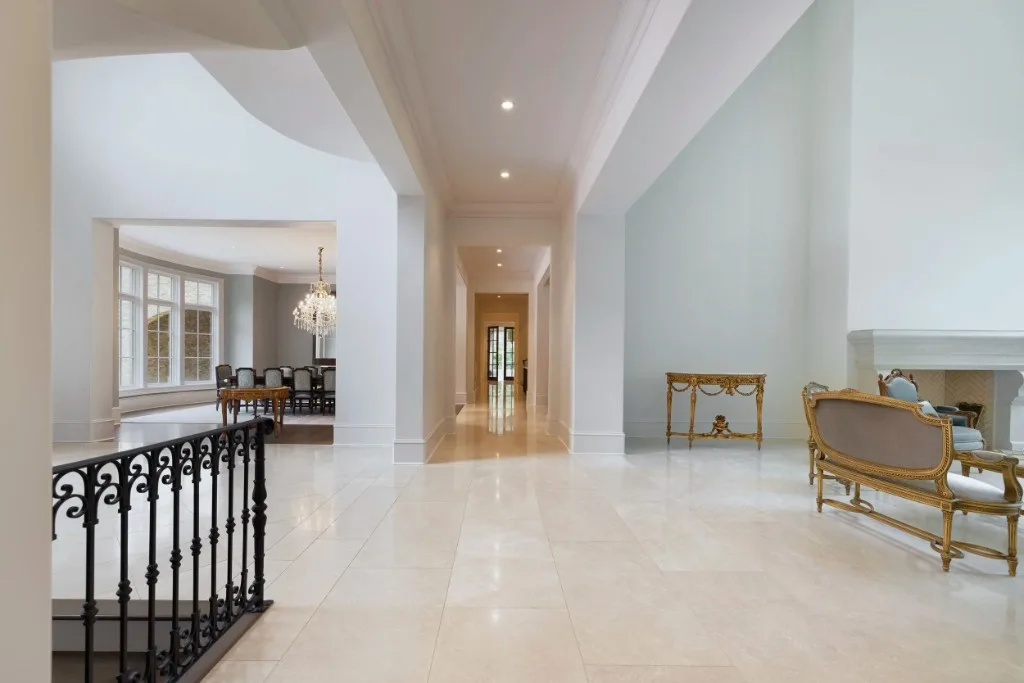 Paces Ferry Estate — gallery hall with limestone fireplace
