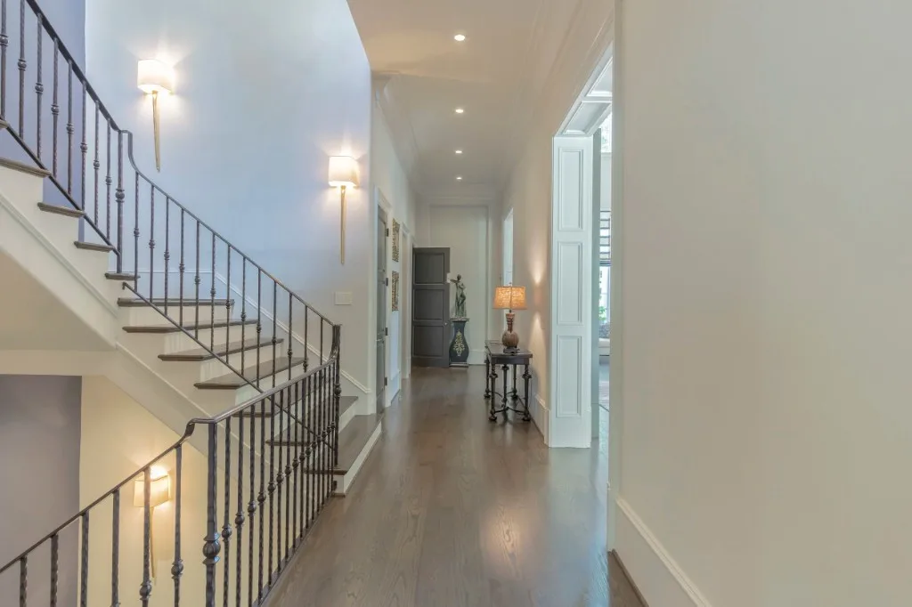 Peachtree Rd — gallery hall with iron staircase