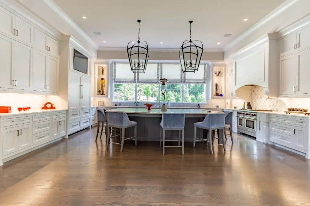 Peachtree Rd — white kitchen with lantern pendants and large island