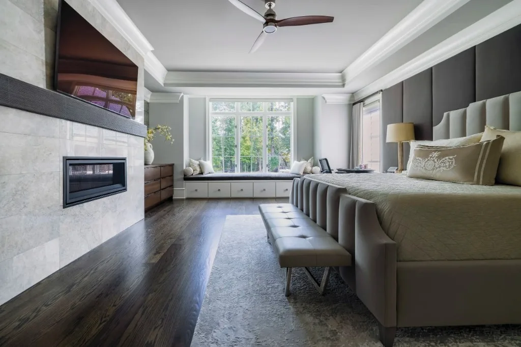 Sugarloaf Residence — primary bedroom with fireplace and window seat
